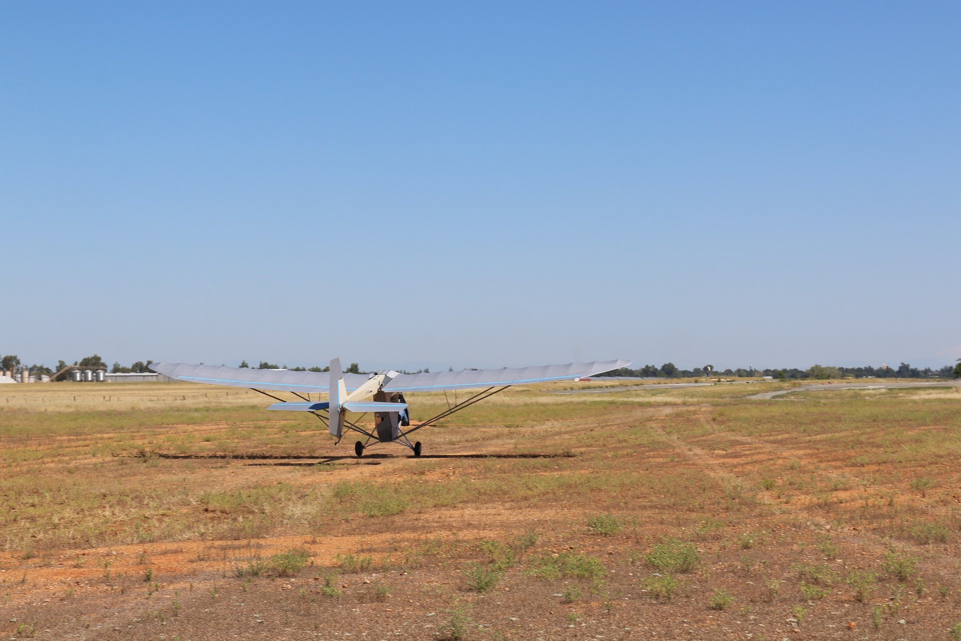 EMG-6 N103MX on the grass — dual tractor motors and folding wings
