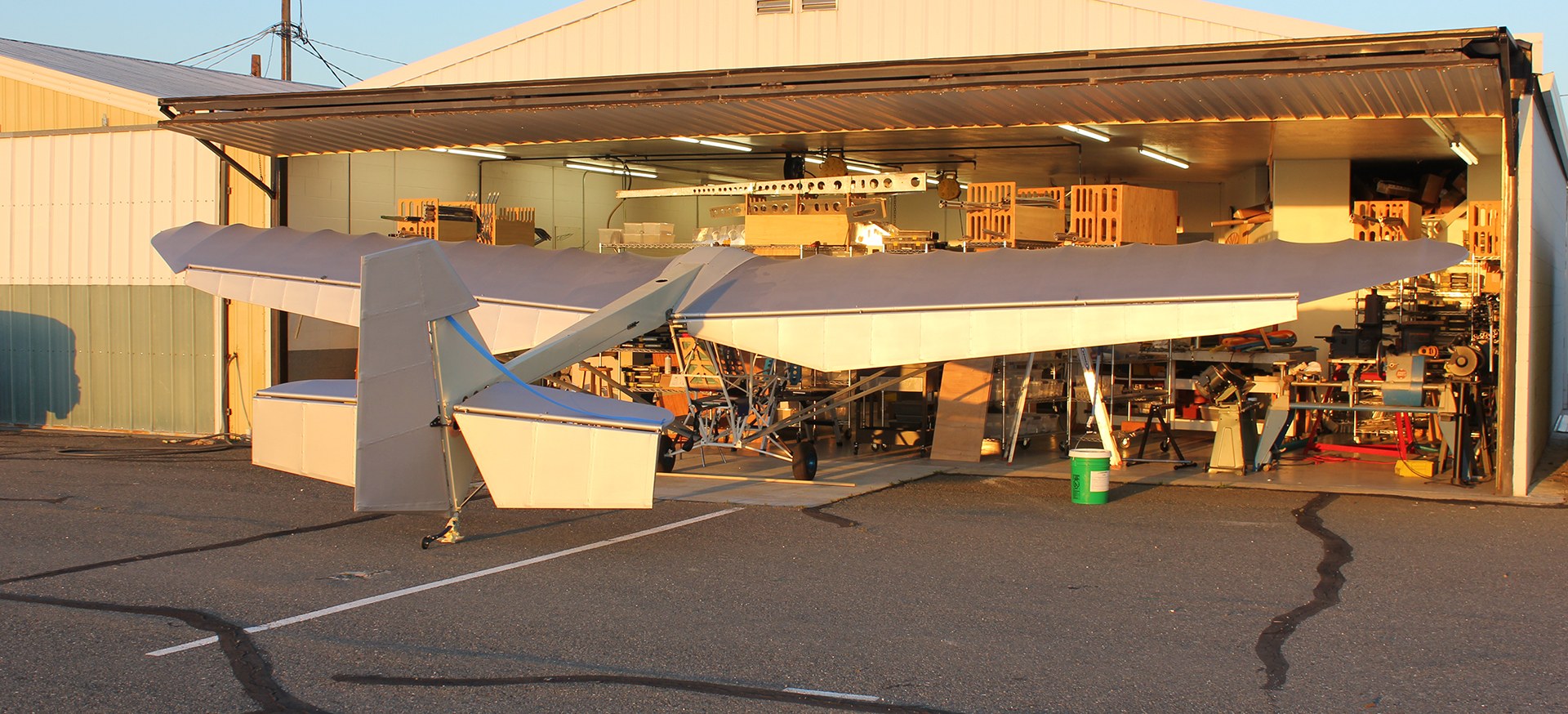 EMG-6 parked at the open hangar door